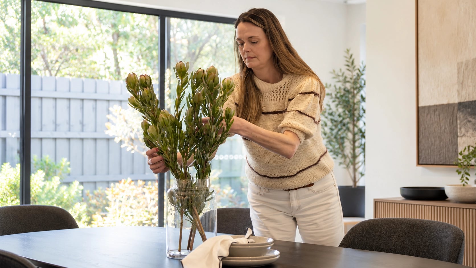 Paula Bowen with Floral Arrangement